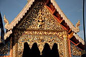 Chiang Mai - The Wat Phra Singh temple. The large Viharn Luang (main prayer hall) with an intricately carved front.  